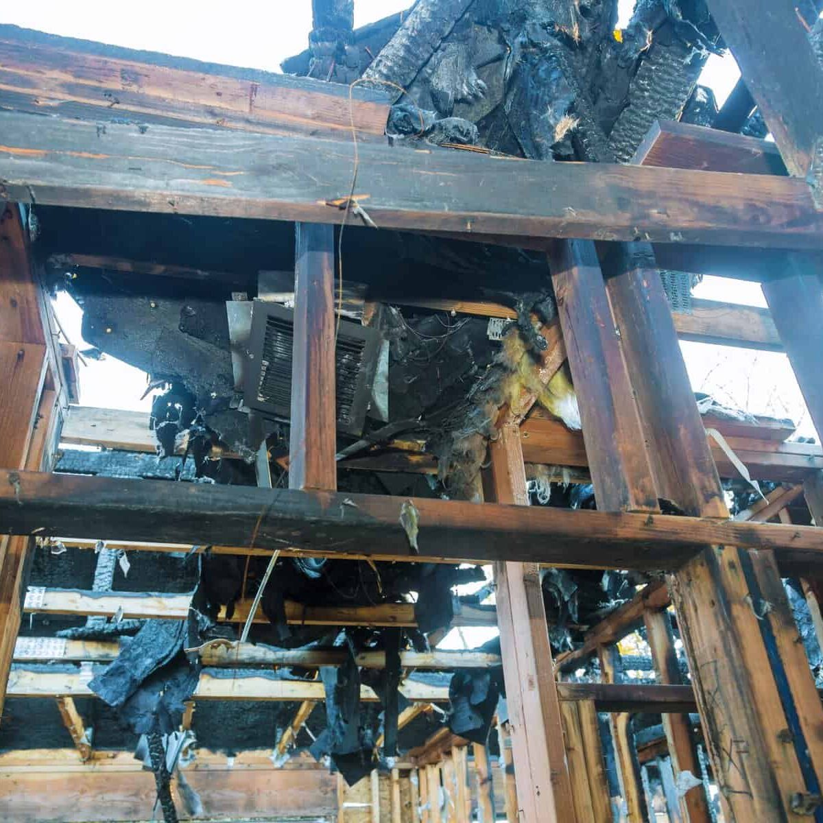 Interior of a home damaged wall after a fire in a wooden house